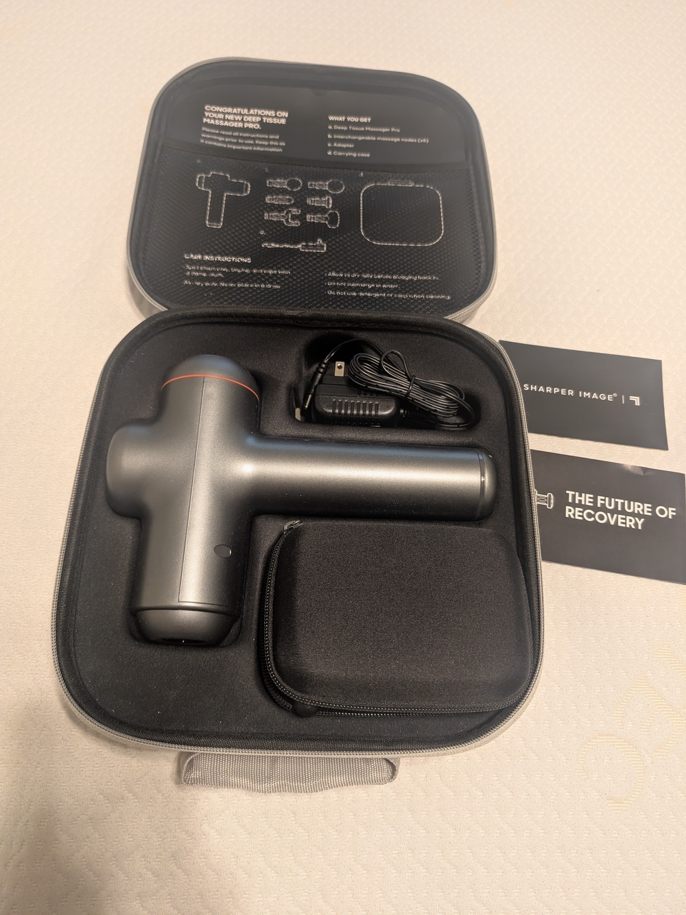 Sharper Image Percussion Massage Gun in Gunmetal Gray with Orange Accent